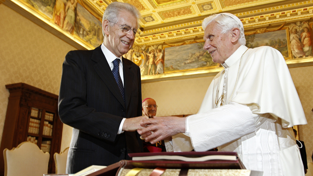 Pope Benedict XVI shakes hand with Italy's Prime Minister Monti during an official visit at the Vatican